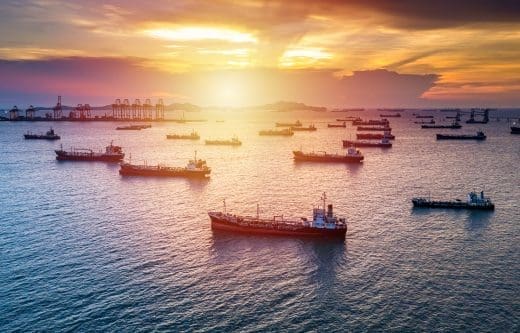 Aerial view tanker cargo vessel oil and gas petrochemical in oil terminal, Global business commercial trade freight fuel chemical and natural gas logistic industry refinery worldwide.